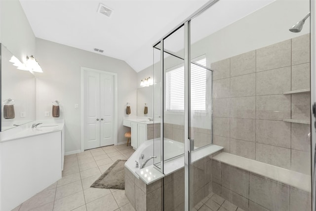 bathroom with vaulted ceiling, tile patterned flooring, a shower stall, visible vents, and a garden tub