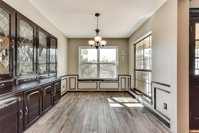 1770 Plummer Dr, Rockwall, TX 75087 - dining area with a chandelier and light wood-type flooring