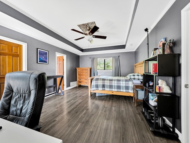 1770 Plummer Dr, Rockwall, TX 75087 - bedroom with a tray ceiling, dark wood-style flooring, crown molding, baseboards, and a ceiling fan