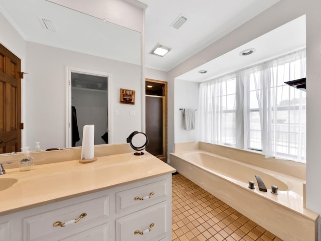 1770 Plummer Dr, Rockwall, TX 75087 - bathroom with a bath, vanity, tile patterned flooring, a shower stall, and ornamental molding