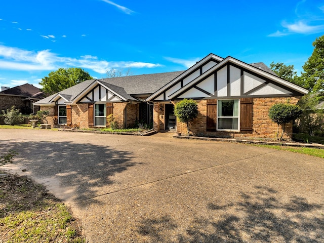 1770 Plummer Dr, Rockwall, TX 75087 - english style home with brick siding and a shingled roof