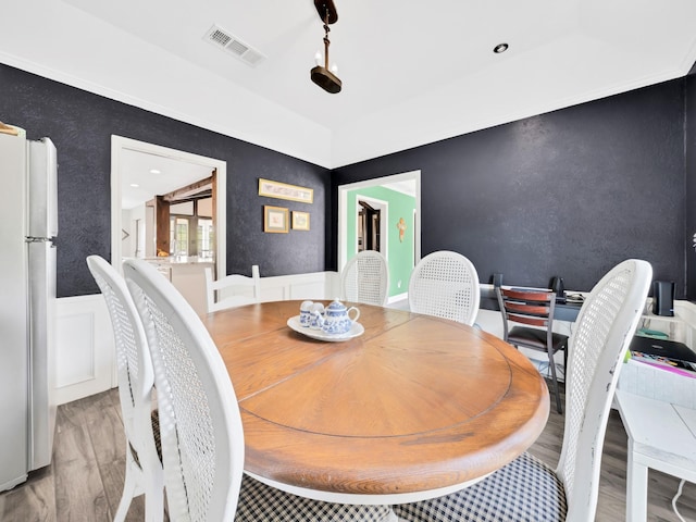 1770 Plummer Dr, Rockwall, TX 75087 - dining room featuring wood finished floors and a wainscoted wall