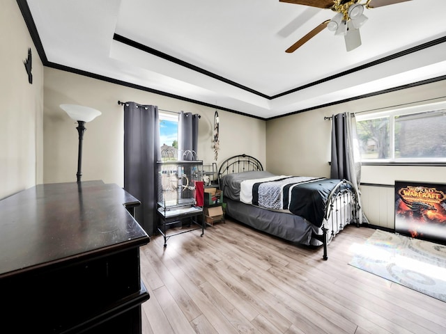 1770 Plummer Dr, Rockwall, TX 75087 - bedroom with a tray ceiling, ornamental molding, multiple windows, light wood-type flooring, and ceiling fan