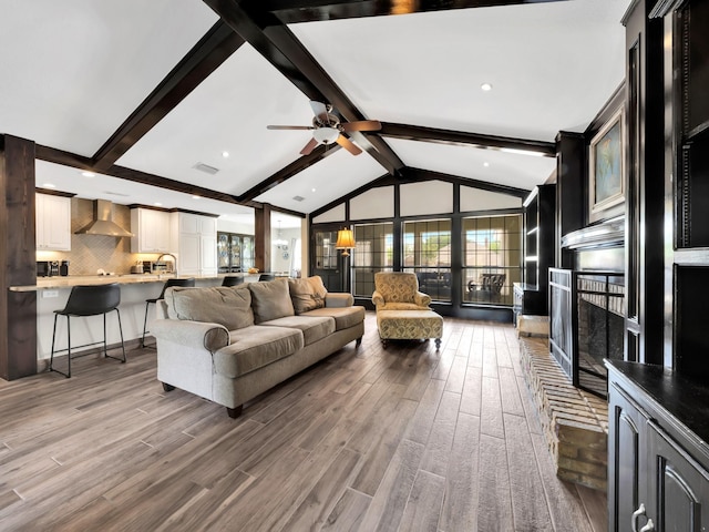 1770 Plummer Dr, Rockwall, TX 75087 - living area featuring ceiling fan, wood finished floors, and a fireplace
