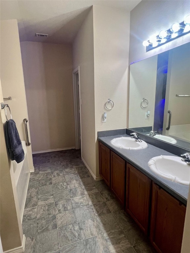 112 Jimmie Birdwell Blvd, Ferris, TX 75125 - bathroom with a sink, visible vents, and double vanity