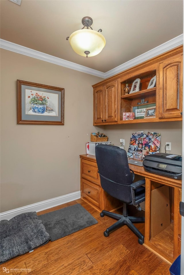306 N Hampton St, Haughton, LA 71037 - office space featuring crown molding, built in desk, wood finished floors, and baseboards