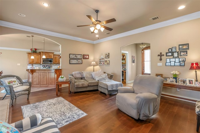 306 N Hampton St, Haughton, LA 71037 - living area featuring arched walkways, ceiling fan, dark wood-style floors, crown molding, and baseboards