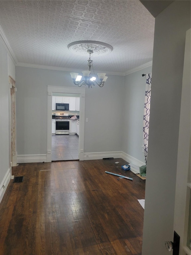 409 Forest Ave, Shreveport, LA 71104 - unfurnished dining area featuring a chandelier, dark wood finished floors, and crown molding