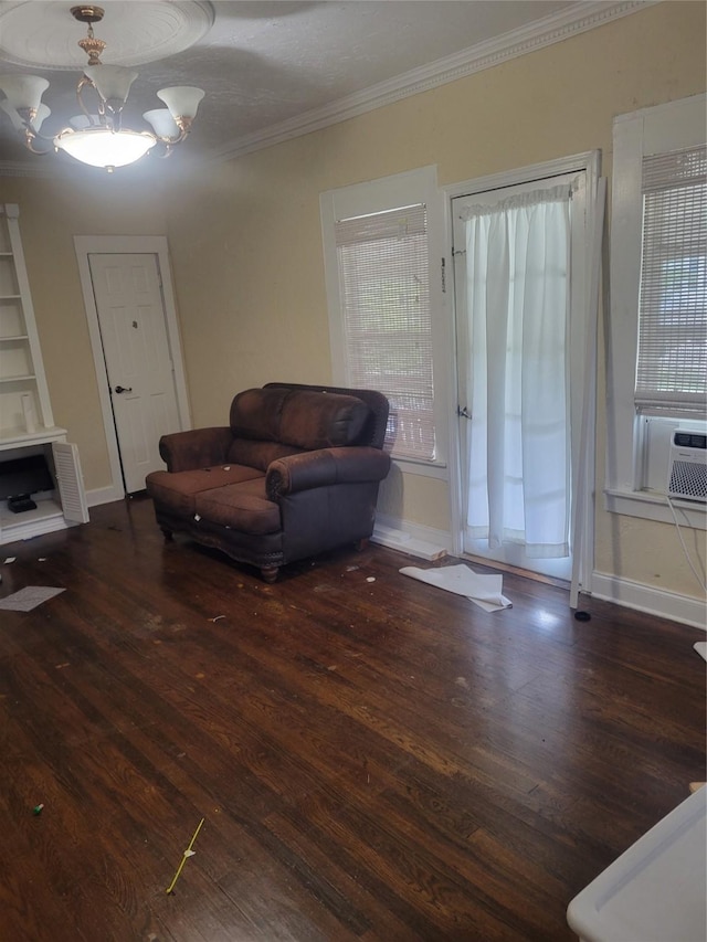 409 Forest Ave, Shreveport, LA 71104 - living area featuring wood finished floors, crown molding, and a chandelier