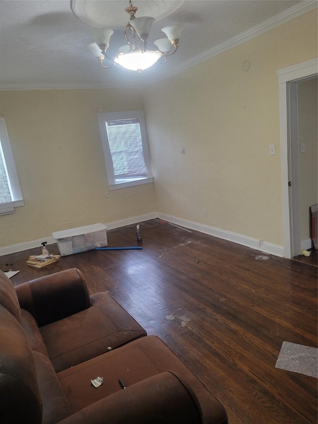409 Forest Ave, Shreveport, LA 71104 - unfurnished living room with crown molding, hardwood / wood-style flooring, and a chandelier