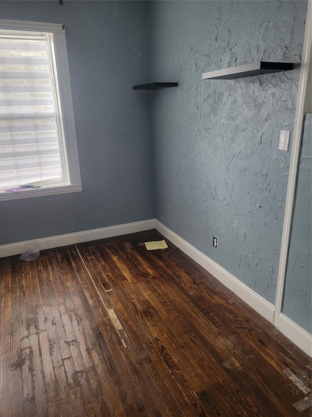 409 Forest Ave, Shreveport, LA 71104 - unfurnished room featuring dark wood-style floors and baseboards