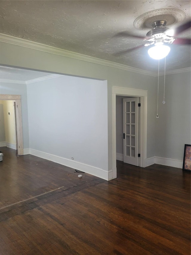 409 Forest Ave, Shreveport, LA 71104 - unfurnished room featuring dark wood finished floors, ceiling fan, and crown molding