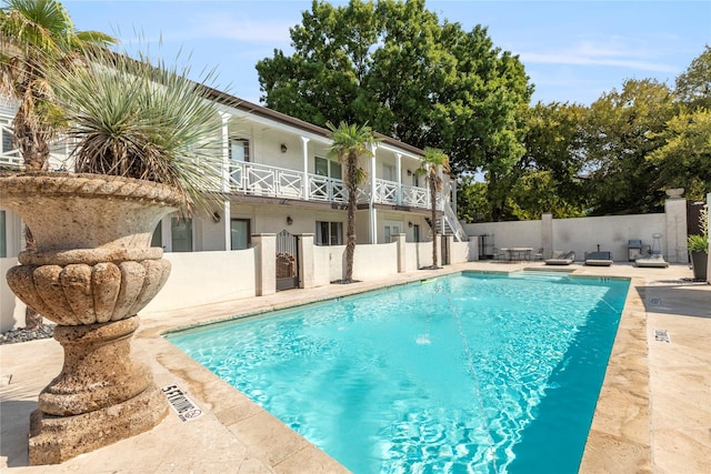 5925 E University Blvd Unit 133, Dallas, TX 75206 - view of pool with a patio, a fenced in pool, fence, and stairs