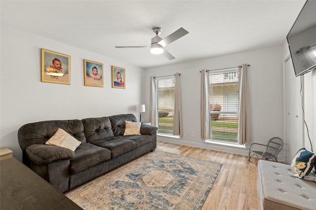 5925 E University Blvd Unit 133, Dallas, TX 75206 - living room featuring light wood-style floors and ceiling fan