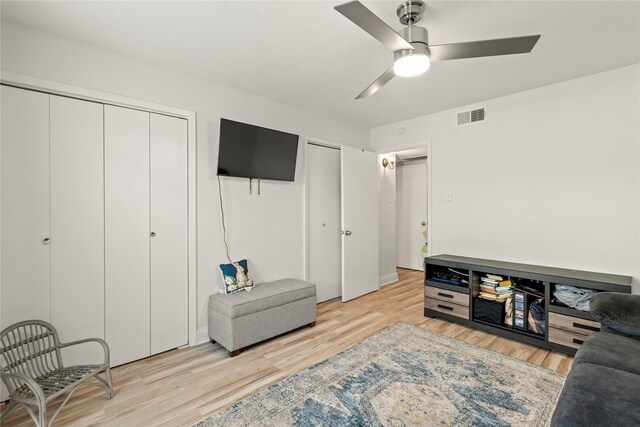 5925 E University Blvd Unit 133, Dallas, TX 75206 - living room with light wood finished floors, visible vents, and a ceiling fan