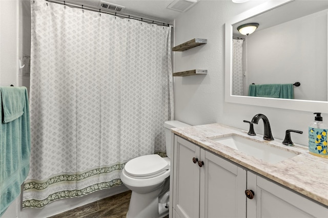 5925 E University Blvd Unit 133, Dallas, TX 75206 - bathroom featuring visible vents, toilet, and vanity