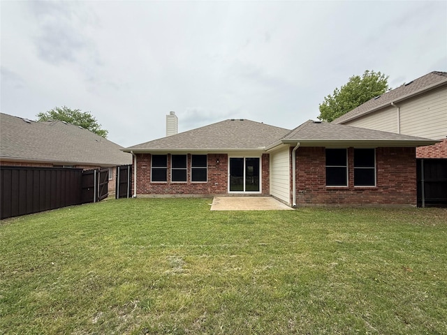 2610 Eganridge Ln, Rockwall, TX 75087 - rear view of house with a chimney, brick siding, a patio area, and a shingled roof