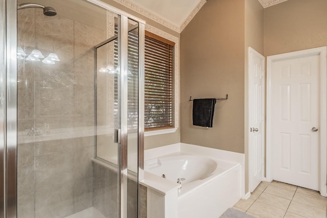 full bathroom with tile patterned flooring, a bath, and a stall shower