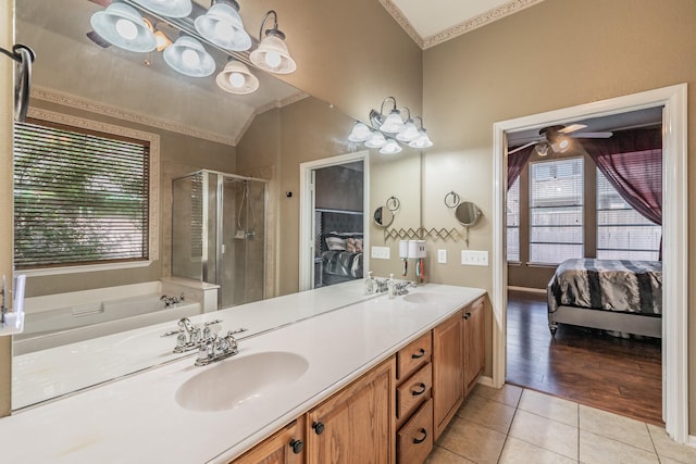 bathroom featuring a shower stall, tile patterned floors, a sink, and plenty of natural light