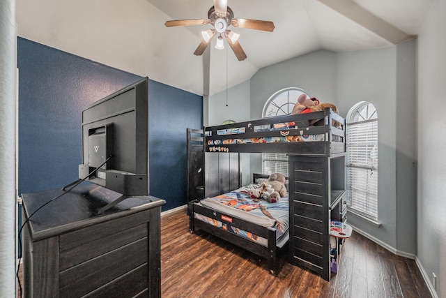 bedroom with wood finished floors, baseboards, a ceiling fan, and lofted ceiling
