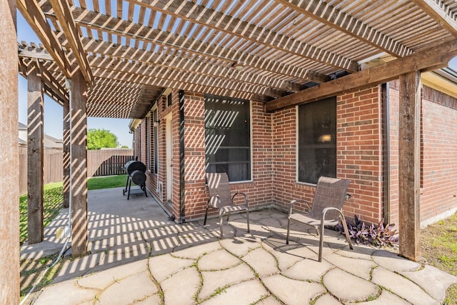 view of patio / terrace featuring fence and a pergola