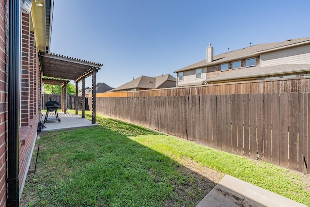 view of yard with a pergola, a patio, and a fenced backyard