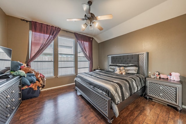 bedroom with ceiling fan, vaulted ceiling, hardwood / wood-style floors, and baseboards