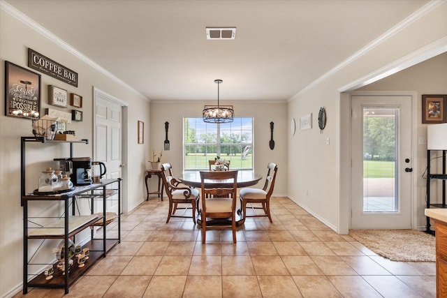 dining room with visible vents, a notable chandelier, light tile patterned floors, and crown molding