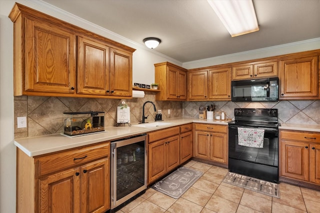 kitchen with brown cabinetry, a sink, wine cooler, and black appliances