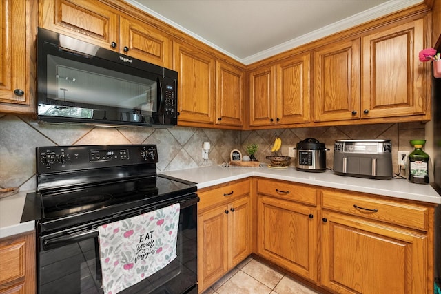 kitchen featuring decorative backsplash, black appliances, brown cabinetry, light countertops, and light tile patterned floors