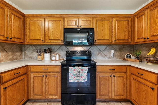 kitchen with light countertops, brown cabinets, black appliances, and crown molding