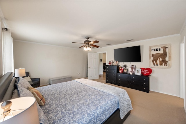 bedroom featuring a ceiling fan, light carpet, baseboards, ornamental molding, and visible vents