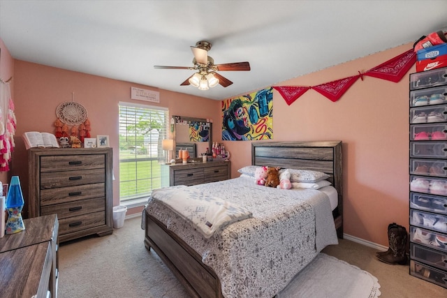 bedroom featuring a ceiling fan, baseboards, and carpet floors