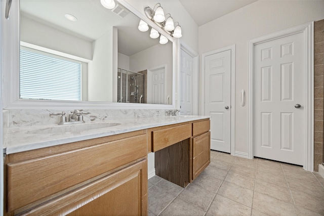 1919 Water Fall Way, Wylie, TX 75098 - bathroom with a stall shower, double vanity, and tile patterned flooring