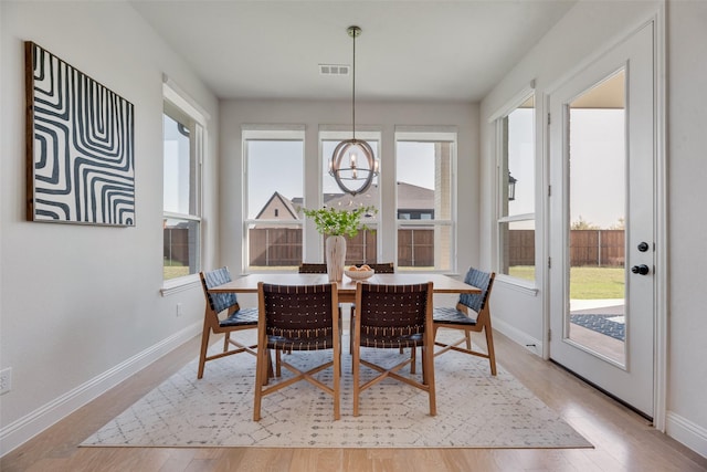 3101 Twin Eagles Dr, Celina, TX 75009 - dining room with baseboards, a notable chandelier, and a healthy amount of sunlight