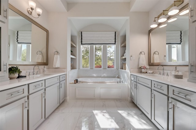 3101 Twin Eagles Dr, Celina, TX 75009 - bathroom with a sink, two vanities, marble finish floor, and a bath