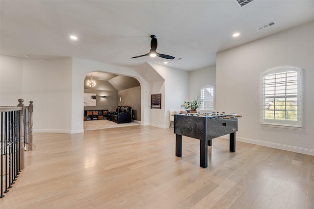 3101 Twin Eagles Dr, Celina, TX 75009 - game room with light wood-style flooring, arched walkways, ceiling fan, and visible vents