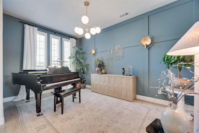 3101 Twin Eagles Dr, Celina, TX 75009 - living area featuring visible vents, baseboards, and a chandelier