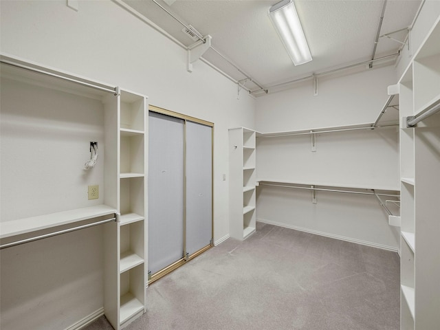 1213 Hills Creek Dr, Mckinney, TX 75072 - walk in closet featuring carpet