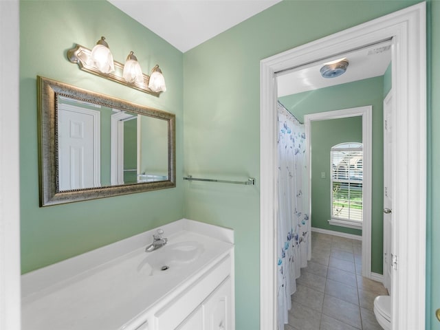 1213 Hills Creek Dr, Mckinney, TX 75072 - full bathroom featuring toilet, vanity, tile patterned floors, and baseboards
