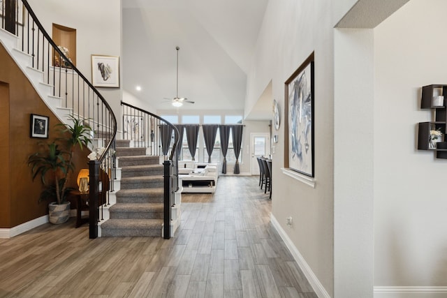 10515 Forest Glen Ln, Grand Prairie, TX 76065 - foyer entrance with stairs, wood finished floors, baseboards, high vaulted ceiling, and a ceiling fan