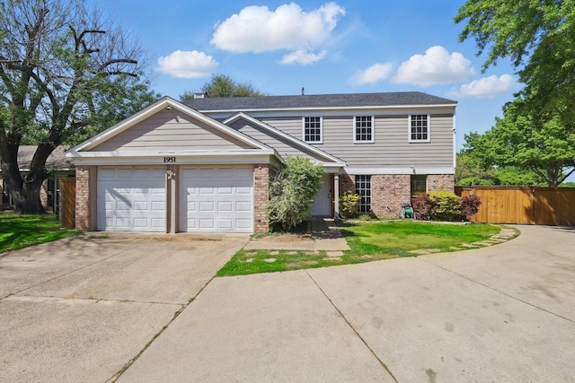 view of front facade featuring concrete driveway, an attached garage, a front yard, brick siding, and fence