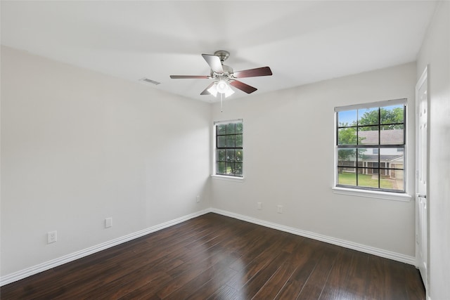 1951 Pin Oak Dr, Flower Mound, TX 75028 - empty room featuring dark wood-type flooring, a ceiling fan, baseboards, and healthy amount of natural light
