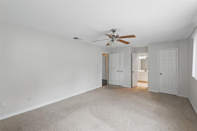1951 Pin Oak Dr, Flower Mound, TX 75028 - unfurnished bedroom featuring light carpet, baseboards, ensuite bathroom, and a ceiling fan