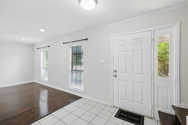 1951 Pin Oak Dr, Flower Mound, TX 75028 - entrance foyer featuring crown molding, baseboards, light wood-style flooring, and recessed lighting