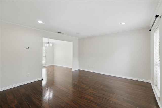 1951 Pin Oak Dr, Flower Mound, TX 75028 - spare room with a chandelier, plenty of natural light, dark wood-type flooring, baseboards, and ornamental molding