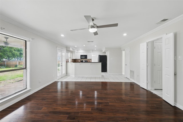 1951 Pin Oak Dr, Flower Mound, TX 75028 - unfurnished living room with light wood-type flooring, a ceiling fan, baseboards, crown molding, and recessed lighting