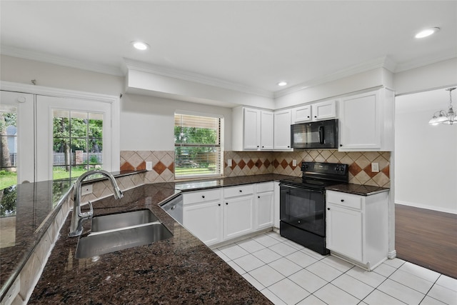 1951 Pin Oak Dr, Flower Mound, TX 75028 - kitchen with black appliances, a sink, dark stone counters, white cabinets, and ornamental molding