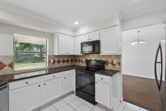 1951 Pin Oak Dr, Flower Mound, TX 75028 - kitchen featuring black appliances, white cabinetry, a chandelier, dark stone countertops, and recessed lighting