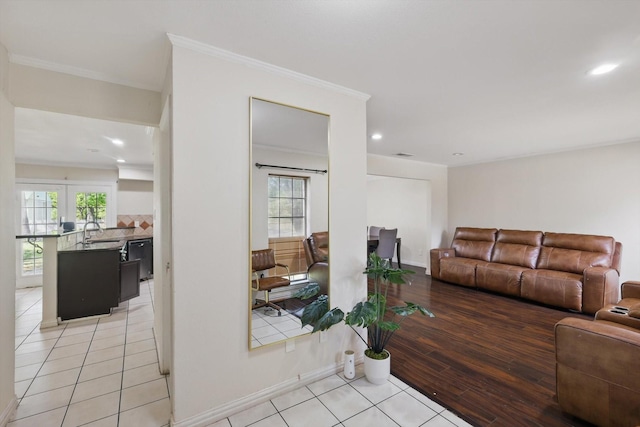living area featuring crown molding, light tile patterned flooring, a wealth of natural light, and recessed lighting